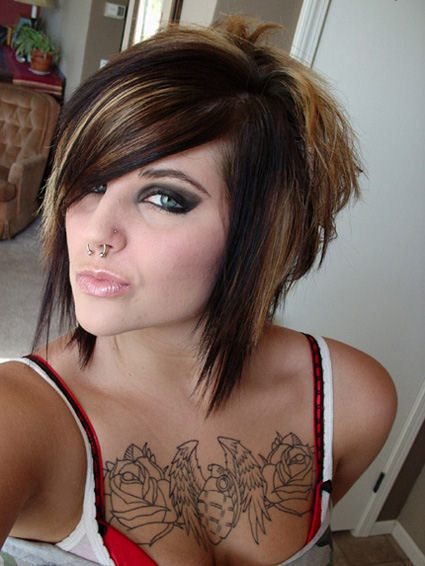Sexy girl with nose ring and grenade chest tattoo